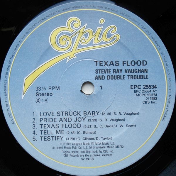 Image of Label Cover of 3425153E: LP - STEVIE RAY VAUGHAN AND DOUBLE TROUBLE, Texas Flood (Epic Light Blue and Yellow; EPC 25534, UK 1983) Strong VG+, Gold Promo Stamp On Rear Sleeve VG+/VG+