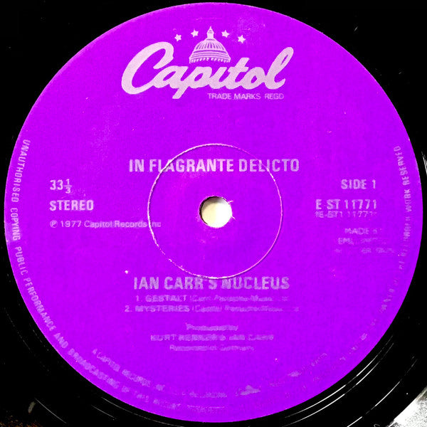 Image of Label Cover of LP - VG/VG - IAN CARR'S NUCLEUS, In Flagranti Delicto (Capitol; EST11771, UK 1978, Laminated Sleeve, Stereo), Strong VG - light hairlines, laminate creasing, gold promo stamp on back cover, - 3946386S