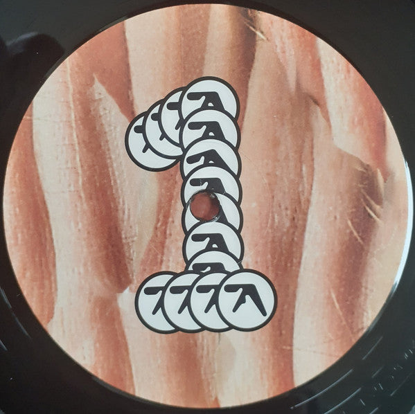 Image of Label Cover of LP - NEW/NEW - APHEX TWIN, Richard D. James Album (Warp; WARPLP43, UK 2020 Reissue, 180 Gram ), , Richard D. James Album was composed by James on his Macintosh computer, and took longer to complete than his previous efforts. The album includes faster breakbeats and intricate drum programming inspired by jungle and drum and bass, as well as lush string arrangements, unstable time signatures, and slow ambient melodies reminiscent of James' previous work, as well as modulated vocals by