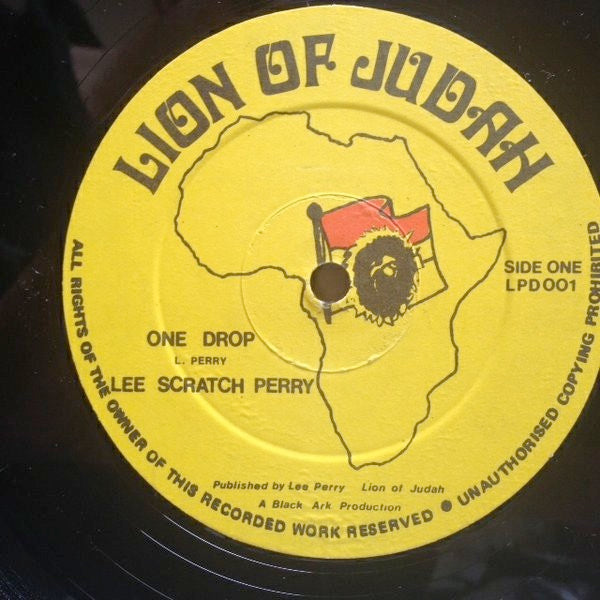 Image of Label Cover of 12" - VG/VG+ - LEE "SCRATCH"PERRY, Judgement In A Babylon / One Drop (Lion Of Judah; LPD001, UK 1985, Picture Sleeve), Clean shiny disc. Sleeve has water damage on left hand side next to spine., - 4016087C