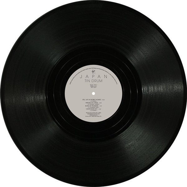 Image of Label Cover of LP - VG+/VG - JAPAN, Tin Drum (Back To Black; V2209, UK 2014 Reissue, 180g), Strong VG. Still in hype stickered shrinkwrap. Corner bump, light wear to opening edge., - 3426146E