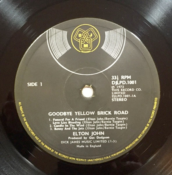 Image of Label Cover of 2xLP - VG/G+ - ELTON JOHN, Goodbye Yellow Brick Road (DJM Black Yellow And White Labels ; DJLPD 1001, UK 1973, Triple Gatefold, Translucent Red/Purple When Held Up To Light. Label variant, Numerical side indicators), Disc 1 a strong G+, glossy vinyl with hairlines. Disc 2 is VG. , - 3926407E