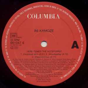 Image of Label Cover of 12" - VG/VG - INI KAMOZE, Here Comes The Hotstepper (Columbia; COL 661047 6, Europe 1994, Picture Sleeve, Sticker), Light marks only, - 4316125C