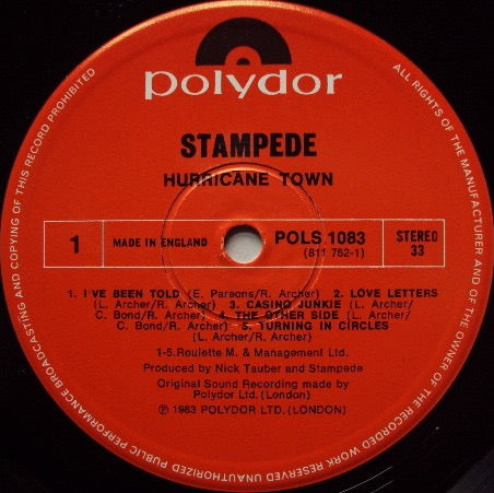 Image of Label Cover of 5015202C: LP - STAMPEDE, Hurricane Town (Polydor; POLS 1083, UK 1983, Promo, NO Merch Insert) Gold Promo Stamp On Rear Sleeve VG/VG+