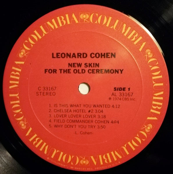 Image of Label Cover of LP - G+/VG - LEONARD COHEN, New Skin For The Old Ceremony (Columbia; KC 33167, US 1974), Water damage on bottom quarter of sleeve - looks particularly bad on the back - has a bit hanging off. A few light hairlines on the record. , - 4126342E