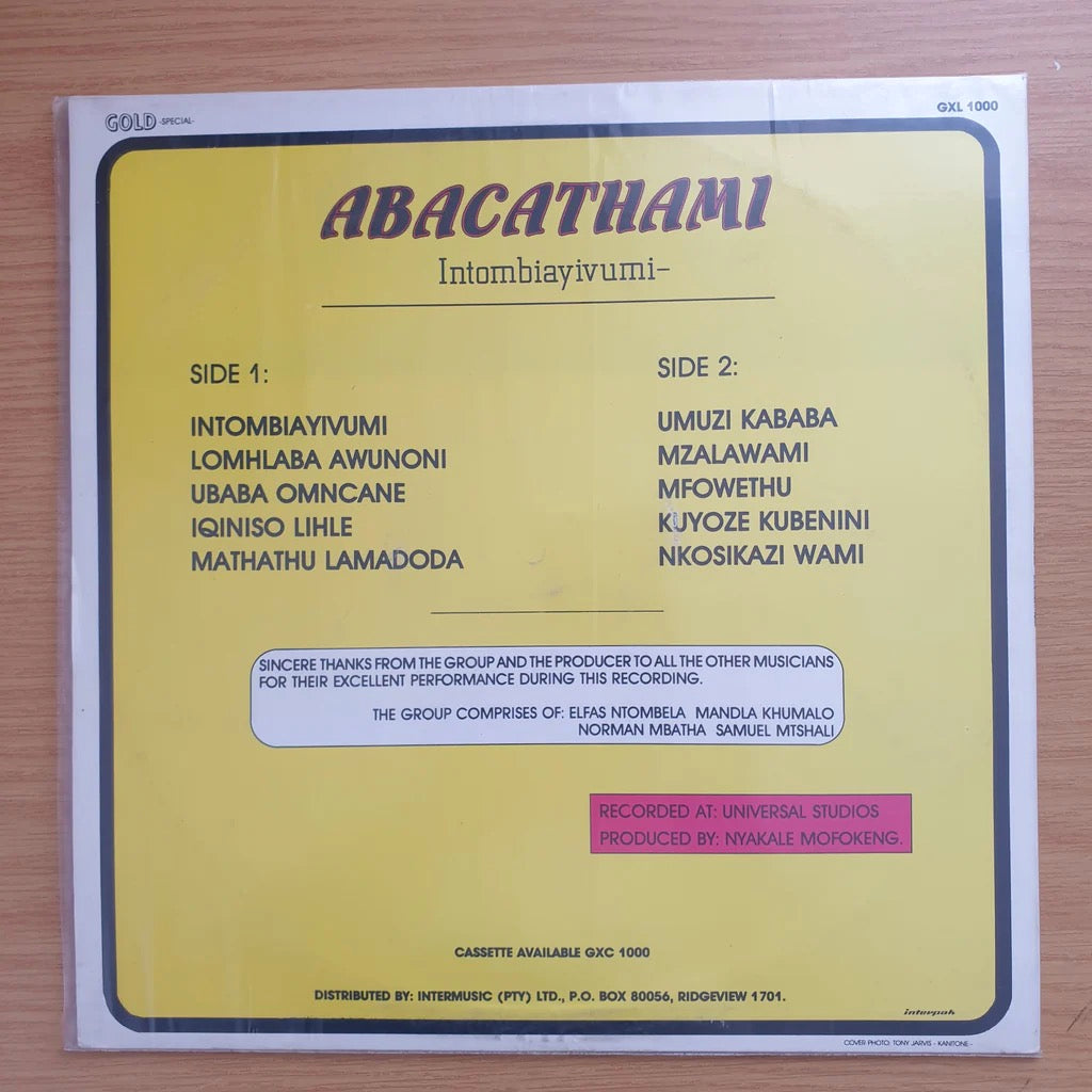 Image of Back Cover of 1124474E: LP - ABACATHAMI, Intombiayivumi (Gold; GXL 1000, UK , Picture Sleeve) Vinyl Strong VG only some light surface marks from storage. Cover looks ok - has some ringwear and a couple marks, downgraded though due to a patch of damage/peel to front. G+/VG
