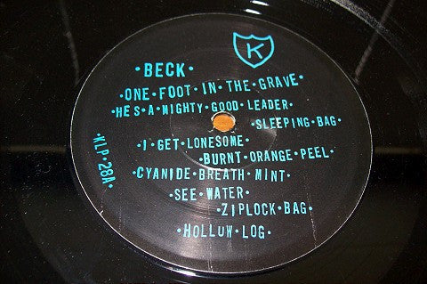 Image of Label Cover of LP - VG/VG - BECK, One Foot In the Grave (K; KLP28, US 1997 Reissue, No Booklet), Small audible pressing defect on A6. Light ring and edge wear., - 4226276E