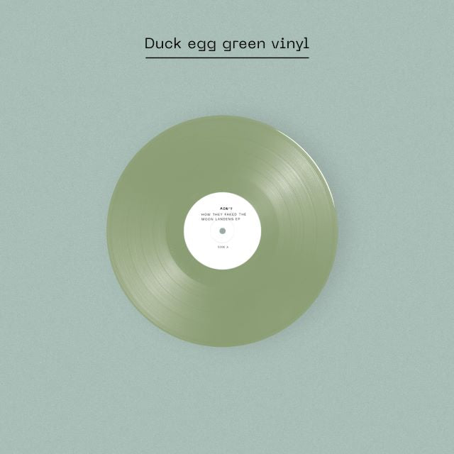 Image of Label Cover of 12" EP - NEW/NEW - AIN T, How They Faked The Moon Landing EP - Dinked Edition (Fear of Missing Out Records; NERD09, UK 2026, Signed Insert, Duck egg green vinyl, Ain t woven patch, Signed, numbered & debossed A5 insert, Exclusive limited pressing of 500, Dinked Early Doors Edition ED.09.), , Today, South London outfit Ain t return with their first new music of 2026. The propulsive new track Grazer comes on the heels of an enviable last year for the five-piece, with highlights that