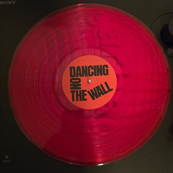 Image of Label Cover of LP - NEW/NEW - MUNA, Dancing On The Wall (Saddest Factory; SAD028LP-C1, Europe 2026, Inner, Clear Red), , MUNA s journey has always been about holding space for the complex, messy, ecstatic realities of life, and with their fourth album, Dancing On The Wall, they ve never been sharper, darker, or more exhilarating. Emerging from the sparkly, confetti-strewn heights of their 2022 self-titled record, MUNA now channel the anxious, uncertain energy of living in a Los Angeles defined by p