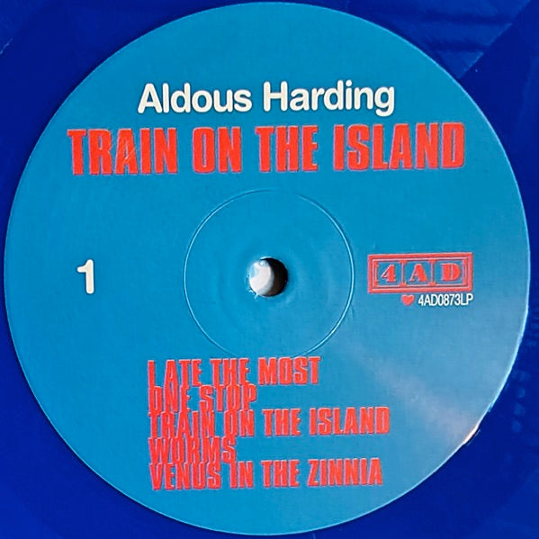 Image of Label Cover of LP - NEW/NEW - ALDOUS HARDING, Train on the Island (4AD; 4AD0873LPE, Europe 2026, Inner, Indie Exclusive Blue Vinyl), , The 10-track Train On The Island was co-produced by long-time collaborator John Parish (PJ Harvey, Dry Cleaning) at Rockfield Studios in Monmouth, Wales, where the pair recorded the New Zealander s previous bodies of work, Party (2017), Designer (2019) and Warm Chris (2022). Joining Harding and Parish on Train On The Island were pedal steel player Joe Harvey-Whyte,