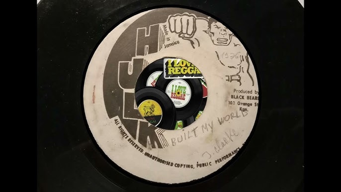 Image of Front Cover of 7" - /VG - JOHNNY CLARKE, Built My World (Hulk; none, Jamaica 1976), Record has patches of fogging and pressing flaws. Label has some light staining and stamped title (faded), - 2416279C