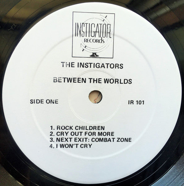 Image of Label Cover of LP - VG+/VG+ - THE INSTIGATORS, Between The Worlds (Instigator Records; IR101, US 1985), Light corner wear on sleeve., - 2616374C
