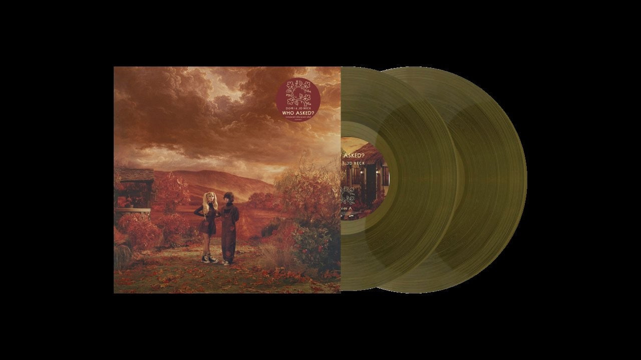 Image of Back Cover of LP - NEW/NEW - DOMI & JD BECK, Who Asked? (Fontana; 5778532, Europe 2026, Transparent Olive), , No, we’re not yelling at you. That’s the answer. WHO ASKED? is the long-awaited sophomore album from the French-born Domi Louna and Texas native JD Beck. Following two GRAMMY nominations, including Best New Artist for a debut album (2022’s NOT TiGHT), WHO ASKED? is unlike anything they’ve done before. Bringing together a small sinfonietta of seasoned classical players, WHO ASKED? showcases