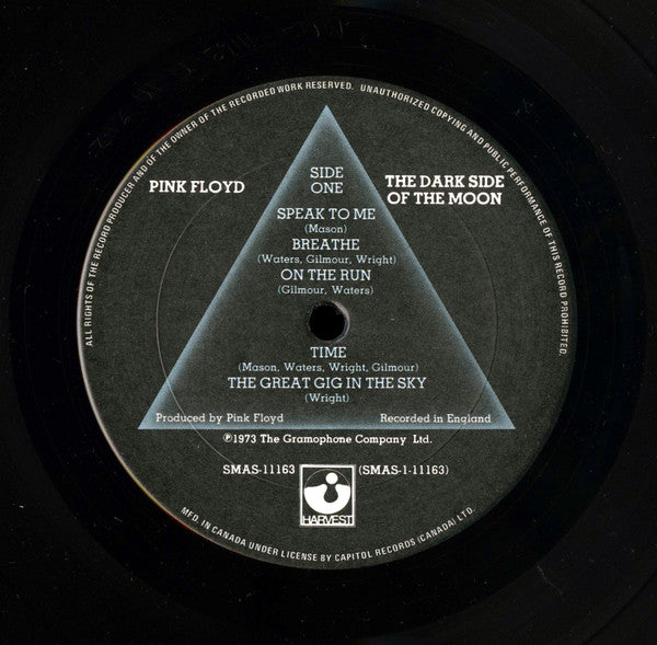 Image of Label Cover of LP - VG/VG - PINK FLOYD, The Dark Side Of The Moon (Harvest; SMAS-11163, Canada 1973, Gatefold, 2 Posters, No Stickers, 'Mfd. in Canada under license by Capitol Records (Canada) Ltd.' on bottom of labels), Strong VG - a few hairlines, light edge & ring wear, posters clean & intact, - 2646304S
