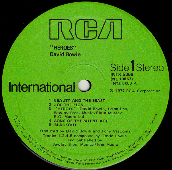 Image of Label Cover of LP - G+/VG - DAVID BOWIE, "Heroes" (RCA International Green International Left Orientated; INTS 5066, UK 1980s Reissue, 3E But No Bilbo Runout Side A, Strawberry Runout Side B), Light marks and some mottling, Small chunk missing at sleeve opening on rear, generally worn. , - 3116090C
