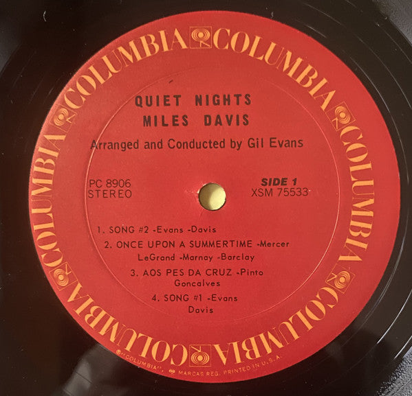 Image of Label Cover of LP - G+/VG - MILES DAVIS, Quiet Nights (Columbia; PC 8906, US 1970s Reissue), Labels have CBS red circular sticker over yellow text. Sleeve worn with some staining, two stickers on either end of spine, and a CBS sticker at top corner of cover. Also splits at corners and some damage along spine, - 3216315C
