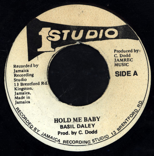 Image of Front Cover of 7" - /VG - BASIL DALEY, Hold Me Baby (Studio One; none, Jamaica Reissue), Record slightly fogged in patches. Labels discoloured with some biro writing on, - 3416289C