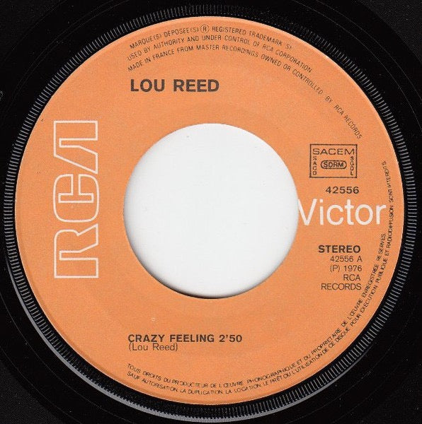 Image of Label Cover of 7" - G+/G - LOU REED, Crazy Feeling (RCA Victor Orange Label; 42556, France 1976, Picture Sleeve, Large Centre), Some light marks and hairlines, Sleeve intact but has ring wear and splodge on rear. , - 3416344C