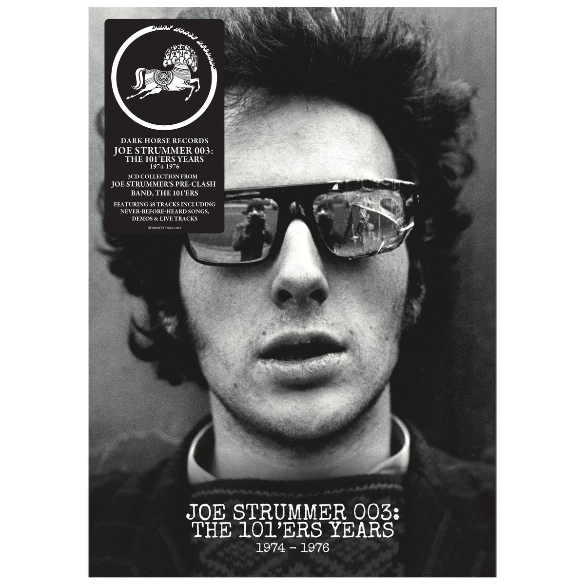 Image of Front Cover of 3xCD - NEW/NEW - JOE STRUMMER & THE 101ERS, Joe Strummer 003: The 101ers Years (BMG; 964217862, UK 2026, 48 Page Hardback Book with Slipcase ), , "Dark Horse Records is proud to release Joe Strummer 003: The 101’ers Years, bringing together studio and live recordings from Joe Strummer’s pre-Clash band, The 101’ers. The 3CD deluxe edition features 48 tracks and is housed in a 48-page hardback book with slipcase. The book includes a foreword by Sex Pistols bassist Glen Matlock, a histo
