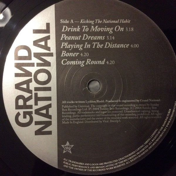 Image of Label Cover of 4725261E: LP - GRAND NATIONAL, Kicking The National Habit (Sunday Best Recordings; sbestlp3, UK 2004) A few light hairlines on the record. Sleeve has lots of small creases around the edges and a large crease in top right, edgewear. G+/VG