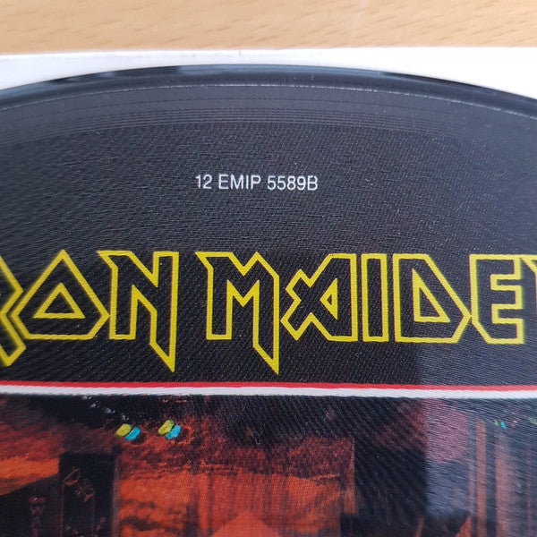 Image of Label Cover of 12" - /G+ - IRON MAIDEN, Stranger In A Strange Land (EMI; 12EMI5589, UK 1986, Picture Disc), Original plastic sleeve grubby and tatty. Hairlines over record but picture intact. , - 2326337E