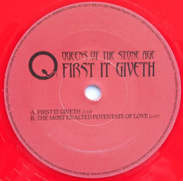 Image of Label Cover of 7" - VG/VG - QUEENS OF THE STONE AGE, First It Giveth (Interscope Records; 981 050-6, Europe 2003, Red Vinyl), Vinyl is fogged on Side B. Sleeve has lots of edge wear., - 4216032C