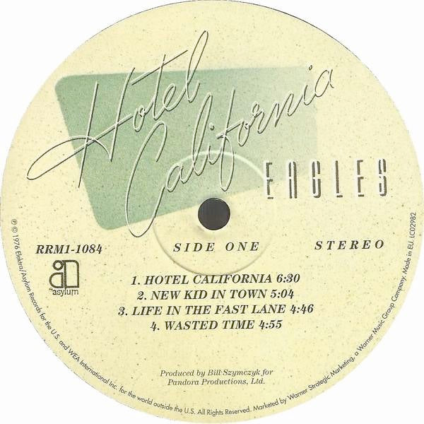 Image of Label Cover of LP - NEW/NEW - EAGLES, Hotel California (Asylum Records; RRM1-1084, Europe 2014 Reissue, Gatefold, Inner, Poster, 180 Gram Vinyl), , The fifth studio album by the American rock band Eagles is Hotel California (1976). It was the band's first album with guitarist Joe Walsh, who replaced founding member Bernie Leadon, and their final album with founding bassist Randy Meisner. David Alexander's photograph of the Beverly Hills Hotel graces the front cover. Hotel California is one of the b