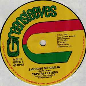 Image of Back Cover of 4615409C: 12" - CAPITAL LETTERS, Smoking My Ganja / Natty Walk (Greensleeves Records; GRED 5, UK 1978, Company Sleeve) Lots of marks on record. Sleeve worn and slightly split at edges, creased, with staining and small biro writing  G+/G