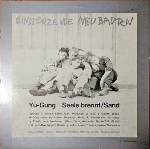 Image of Back Cover of 12" - VG/VG - EINSTURZENDE NEUBAUTEN, Y -Gung (Adrian Sherwood Mix) / Seele Brennt / Sand (Some Bizzare; BART 12, UK 1985, Picture Sleeve), Pressing flaw at the start of B2 which causes a click for a few rotations.,  - 3126135E