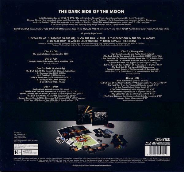 Image of Back Cover of 3734018E: 6xCD - PINK FLOYD, The Dark Side Of The Moon - Immersion Box Set (EMI; 5099902943121, UK 2011, Box Set, 2 Booklets, 4 Art Cards, Replica Ticket Stub, Art Print & Replica Letter, Replica Backstage Pass, 3 CDs, 2 DVDs, Blu-Ray. Scarf, 3 Marbles, 9 Coasters, 2 Booklets, additional memorabilia. Questions for assorted lunatics.)   VG+/EX