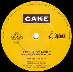 Image of Label Cover of 7" - VG+/VG+ - CAKE, The Distance (Capricorn Records; 574 220-7, UK 1997, Picture Sleeve), Old price sticker outline on sleeve.,  - 3016284C