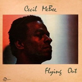 Image of Front Cover of 2314316C: LP - CECIL MCBEE, Flying Out (India Navigation; IN 1053, US 1982) Cut-out (Corner cut). Light ring wear and some creasing to sleeve. Disc is glossy with only the lightest of marks.  VG/VG+