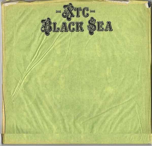 Image of Back Cover of LP - VG+/VG+ - XTC, Black Sea (Virgin; V2173, UK 1980, Insert, Green Outer Paper Bag), Outer Bag in G condition due to black staining to front and tear at bottom. Actual LP sleeve clean and crisp, Glossy disc. ,  - 3816081C