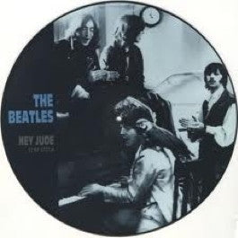Image of Front Cover of 5125336E: 12" - THE BEATLES, Hey Jude (Parlophone; 12RP5722, UK 1988 Reissue, Card Insert, Picture Disc) Record scuffed and lightly warped, but pictures intact. Plastic outer tatty, with price sticker. Ring wear to card insert.   G+/G