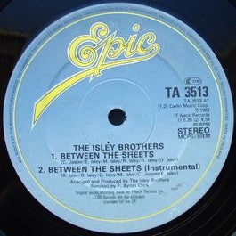 Image of Front Cover of 12" - G/G+ - THE ISLEY BROTHERS, Between The Sheets (Epic; TA 3513, UK 1983, Company Sleeve), Sleeve has corner ripped, wear, creasing, scuffs and an old sticker, A1 - Between The SheetsA2 - Between The Sheets (Instrumental)B1 - Summer BreezeB2 - That Lady (Parts 1 & 2)B3 - Harvest For The World - 2216430C