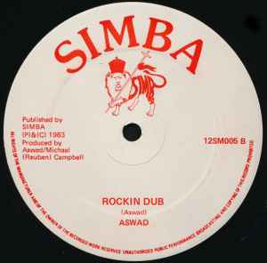 Image of Back Cover of 12" - G+/VG - ASWAD, Roots Rockin (Simba; 12SM005, UK 1983, Company Sleeve), Some printing defects and roughness on label. Sleeve worn, scuffed, lightly stained,  - 2216474C