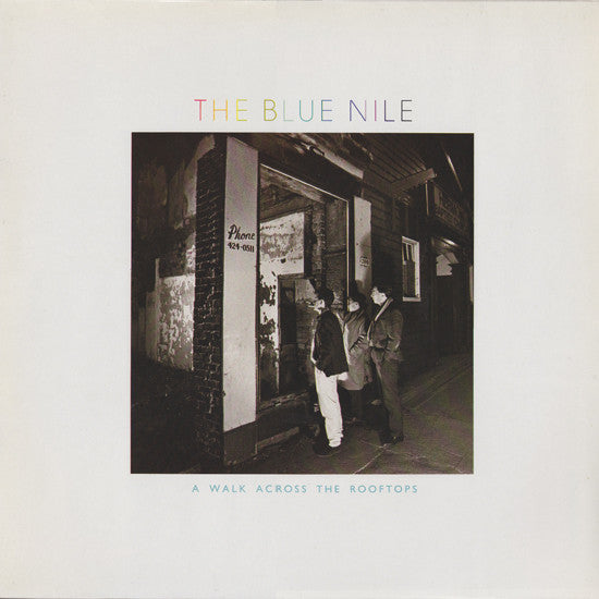 Image of Front Cover of LP - G+/G - THE BLUE NILE, A Walk Across The Rooftops (Linn Records; 206 268, Europe 1985 Reissue), Covered in light marks, plays with unobtrusive background noise. Bottom left corner of sleeve water damaged.,  - 3616074C