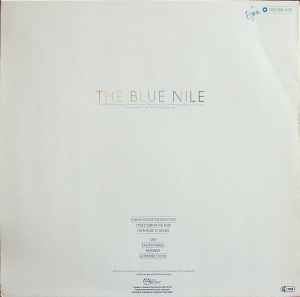 Image of Back Cover of LP - G+/G - THE BLUE NILE, A Walk Across The Rooftops (Linn Records; 206 268, Europe 1985 Reissue), Covered in light marks, plays with unobtrusive background noise. Bottom left corner of sleeve water damaged.,  - 3616074C