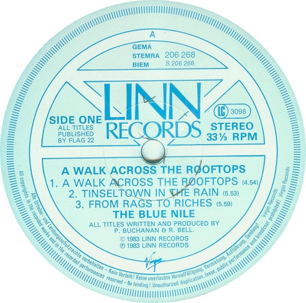 Image of Label Cover of LP - G+/G - THE BLUE NILE, A Walk Across The Rooftops (Linn Records; 206 268, Europe 1985 Reissue), Covered in light marks, plays with unobtrusive background noise. Bottom left corner of sleeve water damaged.,  - 3616074C