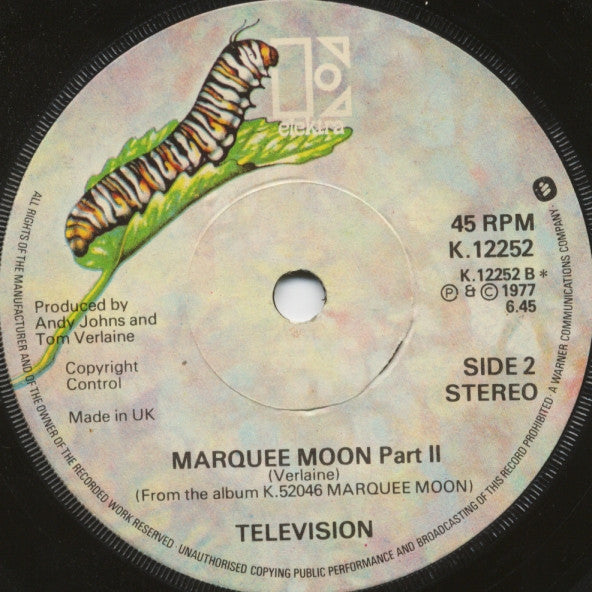 Image of Back Cover of 7" - VG/VG - TELEVISION, Marquee Moon 1+2 (Elektra; K 12252, UK 1977, Company Sleeve), Bit of Music & Video related sticker damage to top of A side label,  - 3516106C