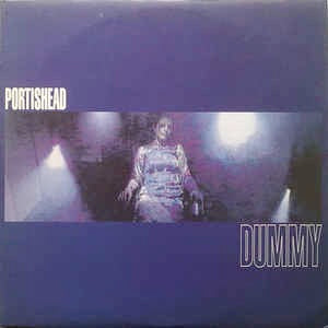 Image of Front Cover of LP - NEW/NEW - PORTISHEAD, Dummy (Go Beat; 8285221, UK 2017 Reissue, Inner, 180 Gram Vinyl), , The collaboration of studio whiz Geoff Barrow and singer Beth Gibbons; gloomy, tormented, and wildly melodramatic moods permeate the album. "Sour Times' (the hit in which Gibbons cries, again and again, "Nobody Loves Me, It's True") and the more cryptic 'Glory Box' are the lynchpins of the album, defining its sound: dark flashes of old soul and film music, dehumanized electronic bleeps, Gib