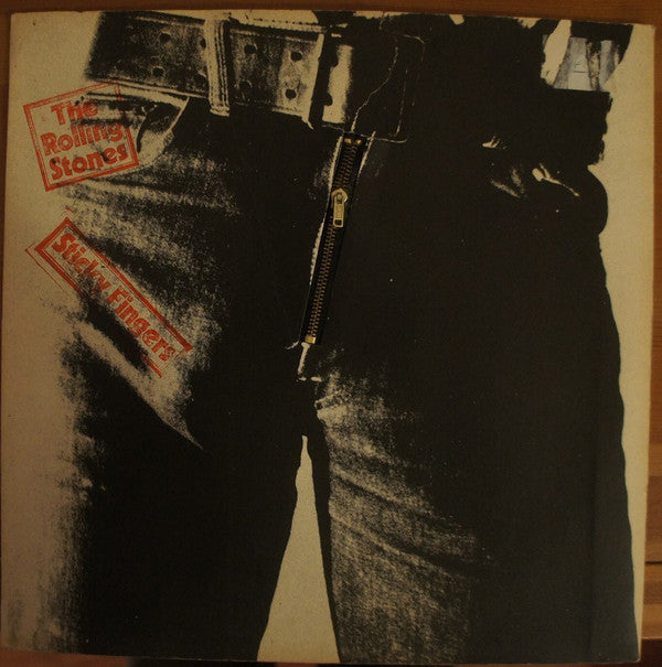 Image of Front Cover of LP - G+/G - THE ROLLING STONES, Sticky Fingers (Rolling Stones; COC59100, UK 1971, Small ALFA Engraved Zip Sleeve, Insert, No Promotone On Labels), Lots of light marks and hairlines, Functioning zip, Buckle mostly intact, Bottom edge of sleeve split. ,  - 1716624C