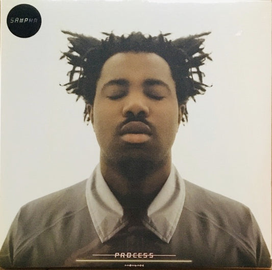 Image of Front Cover of LP - NEW/NEW - SAMPHA, Process (Young Turks; YTLP158, UK 2017, Inner, + CD), , Sampha has quietly but assuredly become one of the UK s most enigmatic and respected artists. Still just twenty seven years old, he has lent his vocal, production and songwriting talents to a range of stand out releases, from UK contemporaries such as FKA twigs, Jessie Ware and SBTRKT to world-renowned superstars like Drake, Kanye West and, most recently this year, on Frank Ocean s Endless and Solange s A 