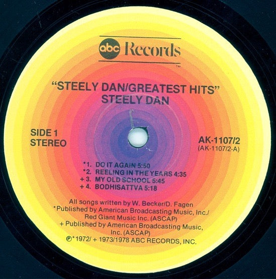 Image of Label Cover of 2xLP - VG/VG - STEELY DAN, Greatest Hits (ABC Orange Concentric Rings - No Note Logo; AK-1107, US 1978, Gatefold), Hairlines, edge  wear, slight crinkle from water damage,  - 2446180S