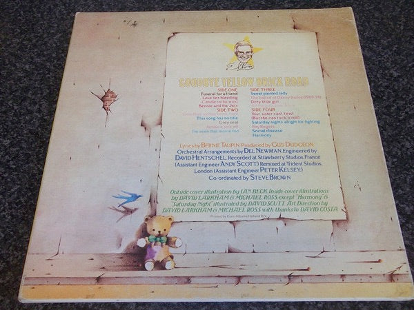 Image of Back Cover of 2xLP - VG/G - ELTON JOHN, Goodbye Yellow Brick Road (DJM Black Yellow and Silver Labels; DJLPD 1001, UK 1973, Triple Gatefold, Numerical Side Indicators, Opaque Vinyl), Lots of light marks and hairlines. ,  - 2316474C