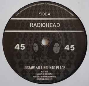 Image of Label Cover of 7" - VG/VG - RADIOHEAD, Jigsaw Falling Into Place / Videotape (Live From The Basement) (XL; XLS326, UK 2008, Picture Sleeve), Sticker Damage To Sleeve,  - 2526500E