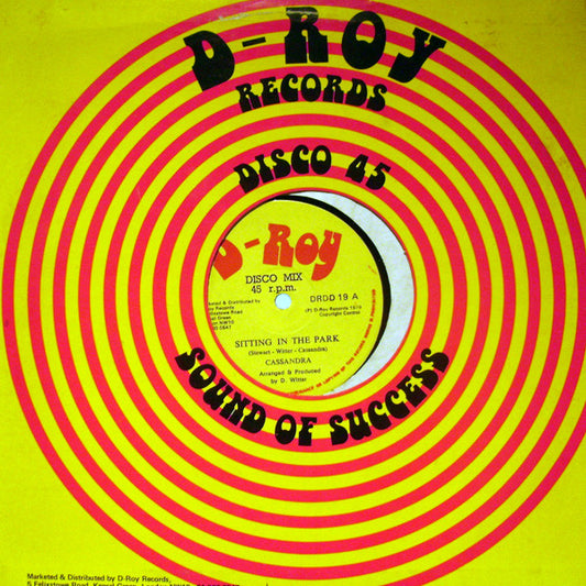 Image of Front Cover of 12" - VG/VG - CASSANDRA, Sitting In The Park / Hyde Park Dub (D-Roy Records; DRDD 19, UK 1979, Company Sleeve), ,  - 2146147S