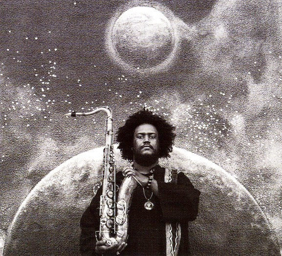 Image of Front Cover of 3xLP - NEW/NEW - KAMASI WASHINGTON, The Epic (Brainfeeder; BF050, US 2015, Box Set, Unusual Item - Please Enquire about Postage), , A brazen release from young Los Angeles jazz giant, composer and bandleader Kamasi Washington. 'The Epic' is unlike anything jazz has seen and not just because it emanates from the boundary-defying Brainfeeder. 'The Epic' is a 172 minute, three volume set (across three LPs) that includes a 32-piece orchestra, a 20-person choir and 17 songs overlaid with 