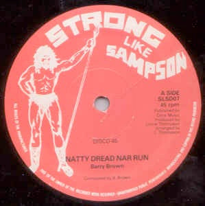 Image of Front Cover of 3124129E: 12" - BARRY BROWN / ANTHONY JOHNSON, Natty Dread Nar Run / Life Is Not Easy (Strong Like Sampson (Red label); SLSD07, UK 1980s, Company Sleeve) Visually quite a few marks on wax but plays like a VG. Tiny writing on sleeve on one side only. Company sleeve has creasing and edgewear.   G+/G+