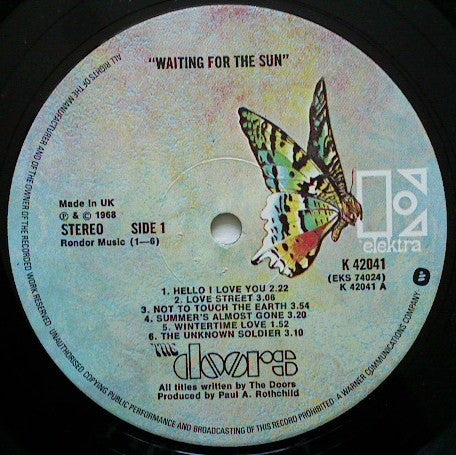 Image of Label Cover of 3624113E: LP - THE DOORS, Waitng For The Sun (Elektra Butterfly, "W" on Label Rim; K42041, UK 1976 Reissue) Sleeve has creasing, ringwear, dented corners. Many light marks and scuffs on vinyl.   VG/G+